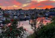 Sunset over the boats and water at Sitka Harbor in Alaska